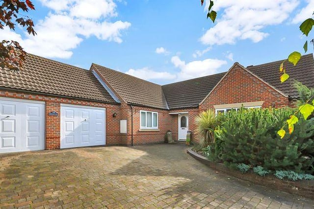 This three bedroom bungalow has a conservatory and an indoor swimming pool.
