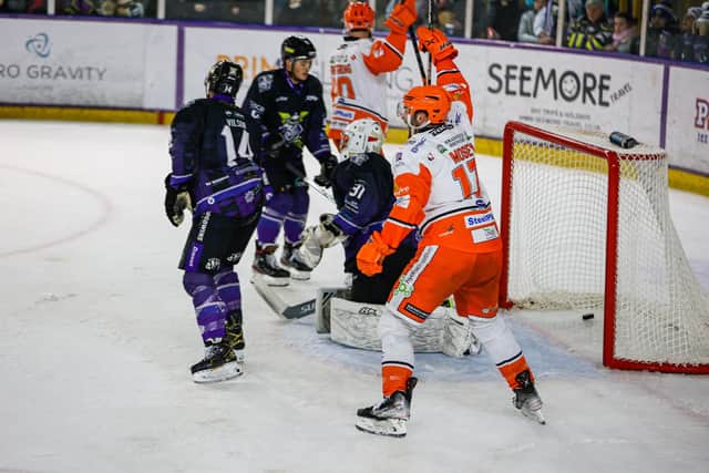 Evan Mosey celebrates after scoring for Sheffield Steelers