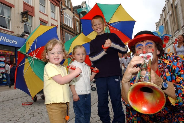 Fire eaters, jugglers and Marco the Clown all provided the Bank Holiday entertainment for the King Street crowds in 2003. Were you there?