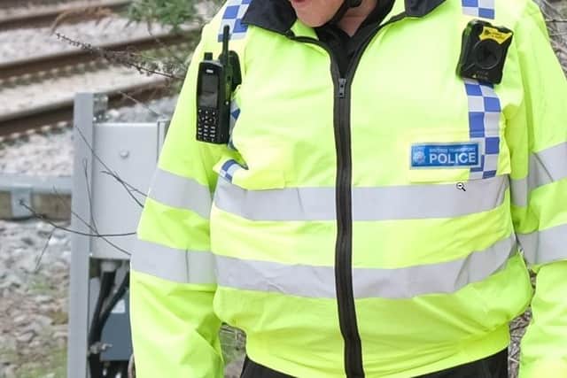 A man has died at a South Yorkshire railway station after being struck by a train, British Transport Police have announced. File picture shows a British Transport Police officer . picture: Dean Atkins