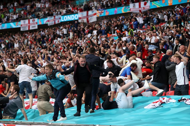 England fans celebrate after their side's first goal was scored by Raheem Sterling at Wembley Stadium (Carl Recine/Pool/Getty Images)