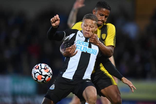 Dwight Gayle of Newcastle United in action with Michael Mancienne of Burton (Michael Regan/Getty Images)