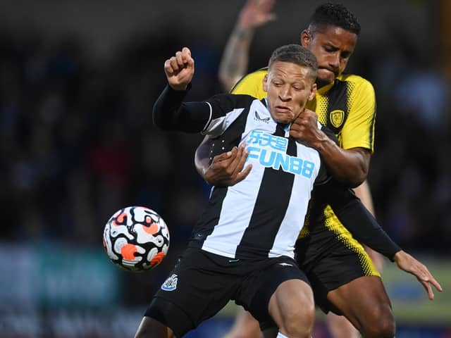Dwight Gayle of Newcastle United in action with Michael Mancienne of Burton (Michael Regan/Getty Images)
