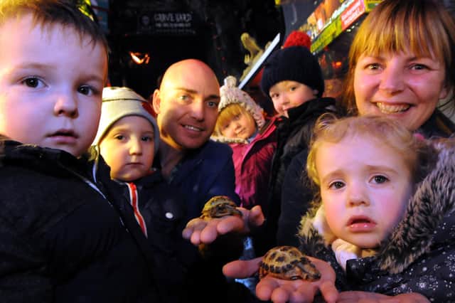 Youngsters and staff from the Sunshine Day Nursery with their new tortoise from Lee's Pets and Aquatics owner Lee Martin. Remember this from five years ago?