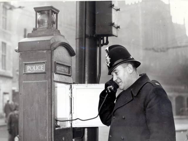 Pc F Bradshaw making a call from a new police telephone box in All Saints Square, Rotherham on January 3, 1957, long before mobile phones were dreamt of