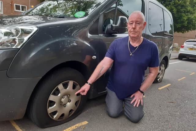 David Bowns shows the damage to his car, which he says was slashed in a spate of vandalism on his street in Crookes