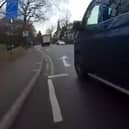 This is the moment a cyclist was knocked off his bike by a van that clipped him after changing lanes without looking while exiting a roundabout.