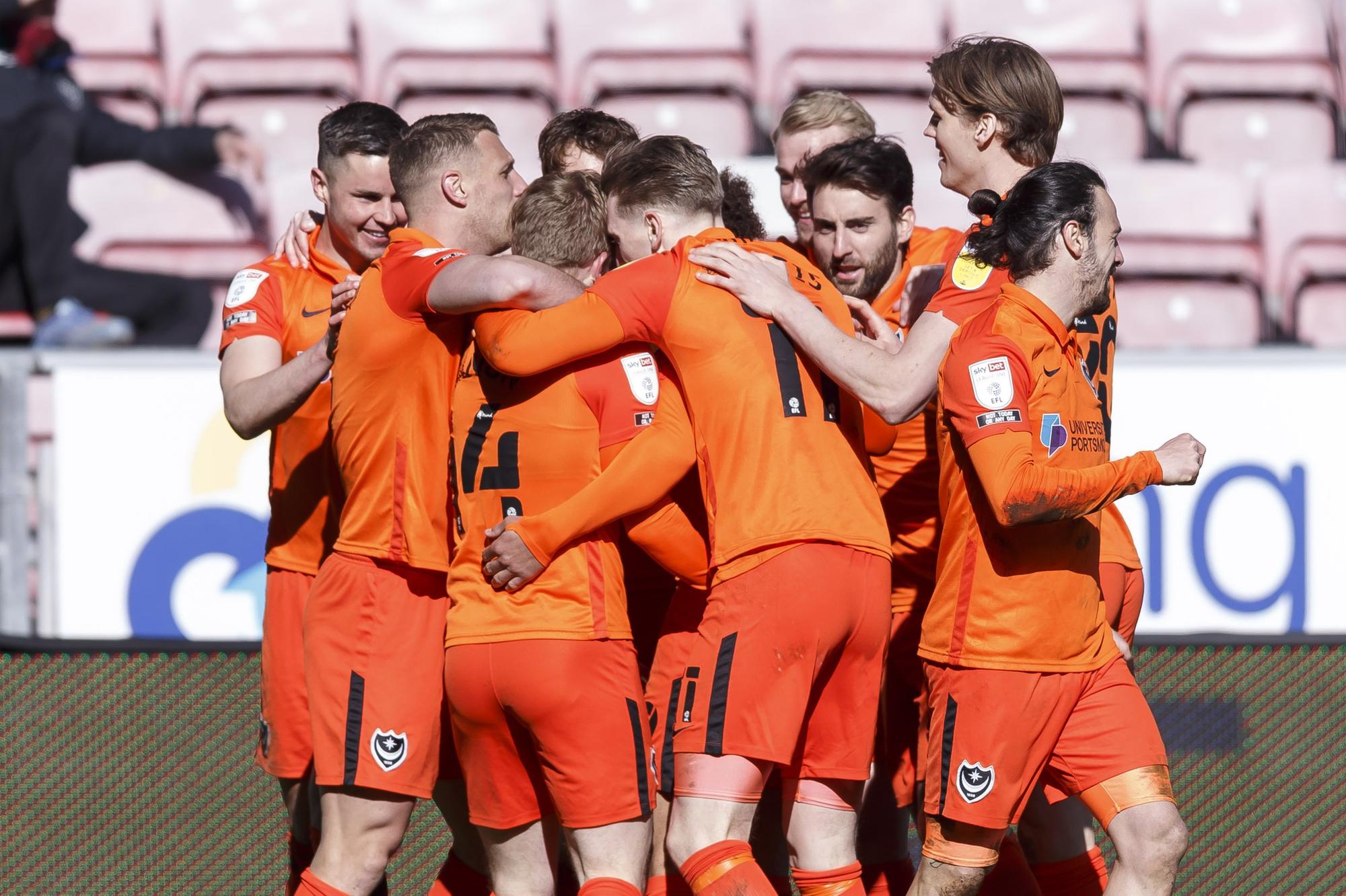 The Pompey players celebrate Andy Cannon's winner against Wigan.  Picture: Daniel Chesterton/PinPep