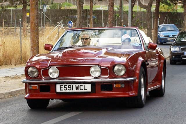 The Beckham's enjoying a trip in the classic car.