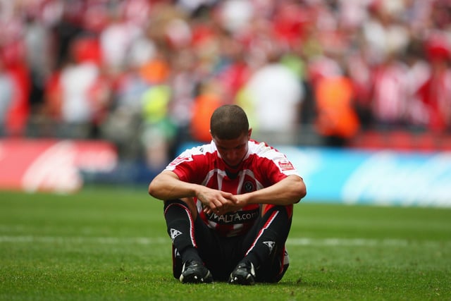 Kyle Walker sits dejectedly on the Wembley turf after United's Coca-Cola Championship play-off final defeat to Burnley in May 2009.