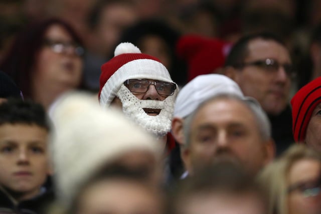 A United supporter disguised as Santa watches on as the Blades take on Bradford City in December 2015.