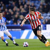 Sheffield United's Sander Berge (right) and Huddersfield Town's Jonathan Hogg battle for the ball