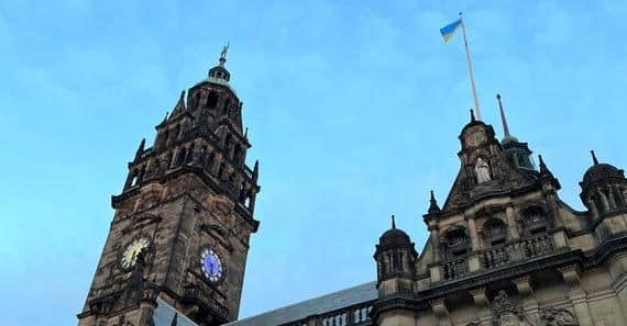 Sheffield Town Hall flying the Ukraine flag with the clock lit up in blue and yellow - Sheffield City Council has announced its bid to host Eurovision 2023, which is coming to the UK as war-torn Ukraine is unable to do so