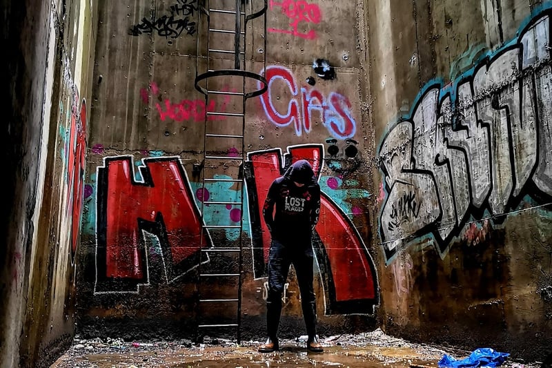 An urban explorer stands at the north portal exit chamber.