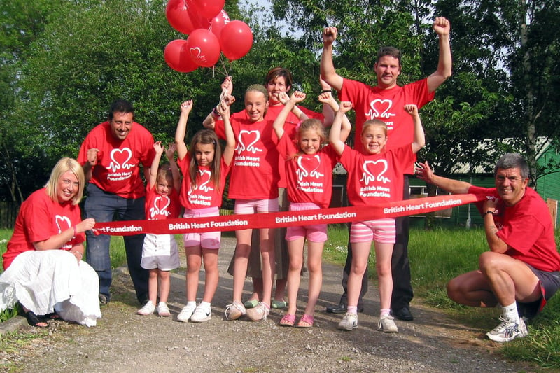 Sheffield family joggers in a Father's Day tribute are, from left,  Julie Hurst, Tony Hurst, Mollie Crump, Sophie Crump, Olivia Hurst, Paige Hurst, Devon Hurst, Martin Crump and Kevin Bazeley from the British Heart Foundation