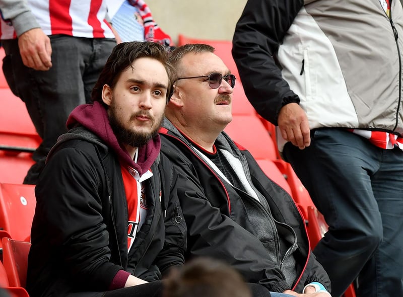 Two Sunderland fans take in the action at the Stadium of Light.