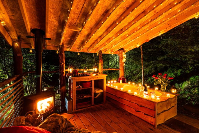 Unplug from the real world and step into a wooded idyll where outdoor baths, fairy lights and  the sounds of owls and blackbirds set the scene for a totally recharging experience.