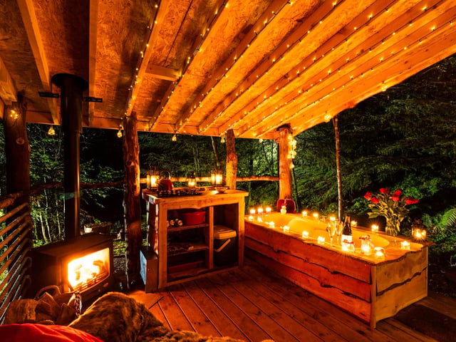 Unplug from the real world and step into a wooded idyll where outdoor baths, fairy lights and the sounds of owls and blackbirds set the scene for a totally recharging experience.
