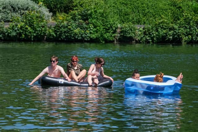 People taking advantage of the hottest day of the year in Crookes Valley Park in Sheffield