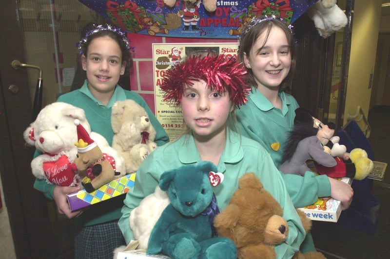 Pictured in 2001 at the Star Office, where pupils from Sheffield High School brought some of the toys that pupils have donated to the  Christmas toy appeal. LtoR are, Jessica Brinkley, Victoria Village, and Mary Boulding.