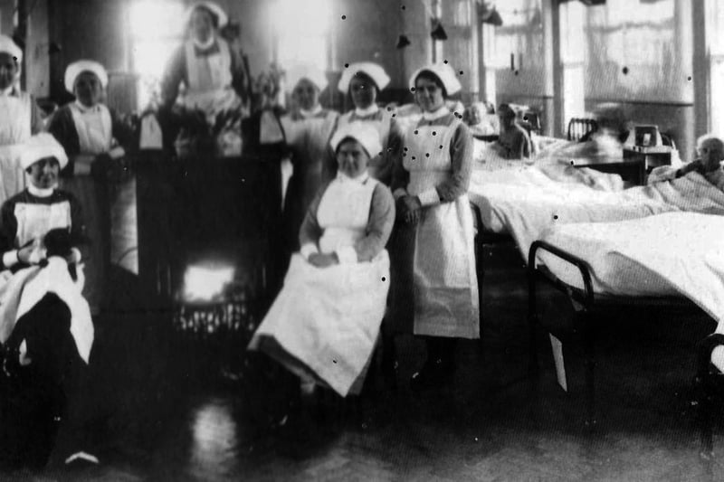 Sisters at The Royal Hospital Haslar in Gosport, huddle around a real coal fire in this undated picture