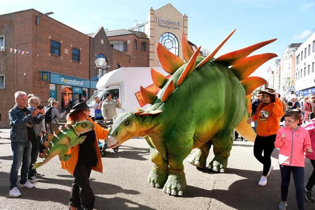 Dinosaurs walk in the town centre