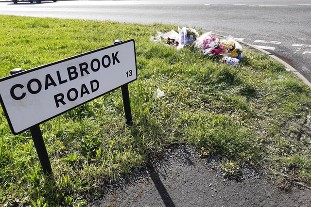 Tributes left by loved ones next to Retford Road, Woodhouse Mill, after a man died in a tragic crash on Monday night