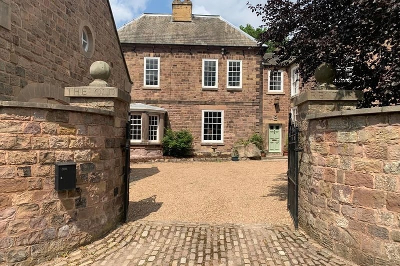 The property is approached off Rectory Gardens, wrought iron gates hung on impressive stone pillars open into a pea-gravelled driveway, which offers off road parking and extends to the front aspect of the house.
