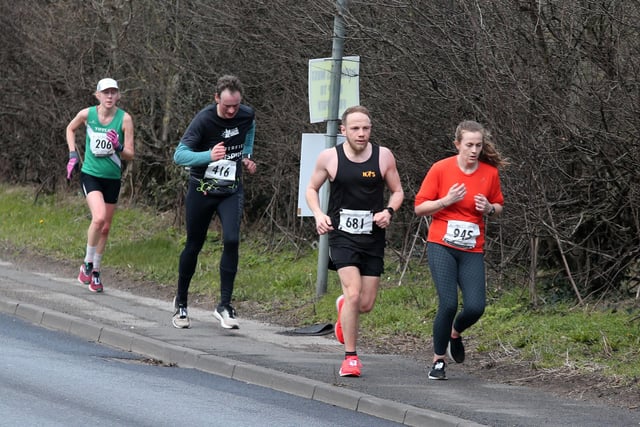 Runners climb the hill on the straight mile into Retford.