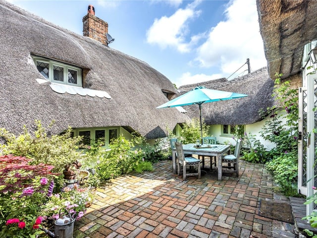 This three bedroom Grade II listed thatched cottage in Nether Wallop is on the market for £900,000. It is listed by Fine and Country.