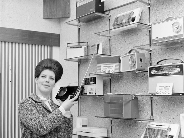 Miss Jemima Betram listens to a transistor radio in the British Relay Television Centre on Dalry Road in June 1965.