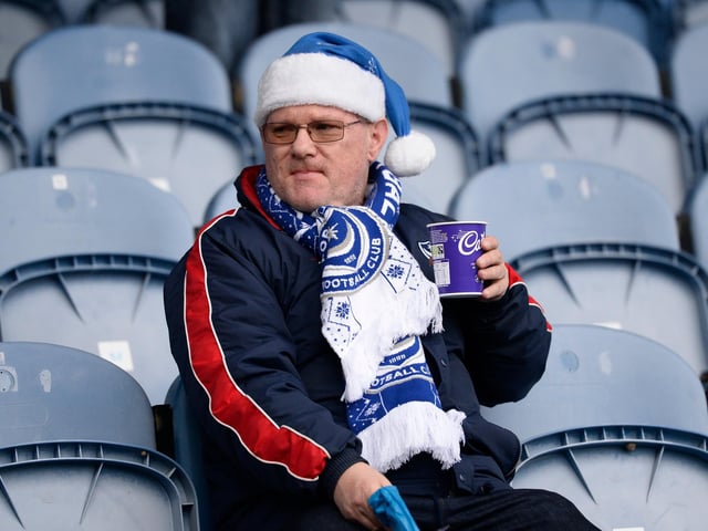This fan settles himself in ahead of the Blues' game against Ipswich just before Christmas.