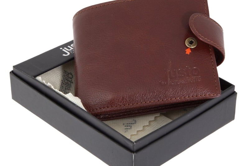 A Russian FSB spy Justo Creazione brand wallet containing a hidden microphone. Includes instruction manuals and original box. Estimate: $500-$700.