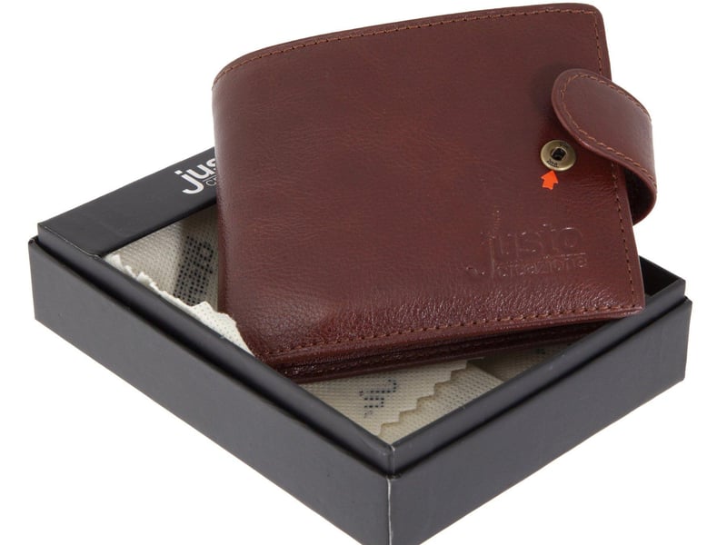 A Russian FSB spy Justo Creazione brand wallet containing a hidden microphone. Includes instruction manuals and original box. Estimate: $500-$700.
