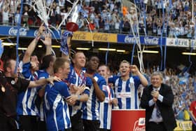 Lee Bullen lifts the League One play-off trophy after victory ovr Hartlepool in Cardiff