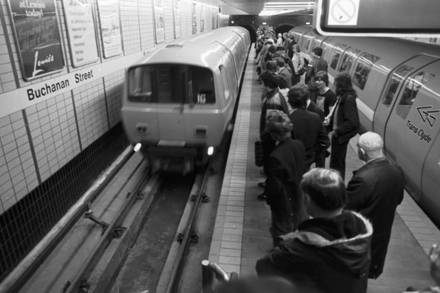 Passengers wait as the underground train arrives at Buchanan Street station in Glasgow - the new system was opened to the public in April 1980.