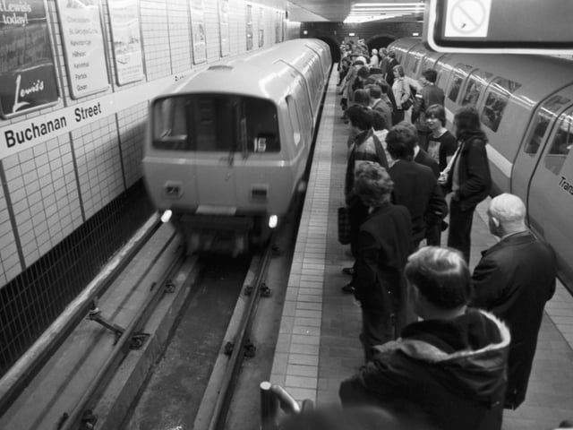 Passengers wait as the underground train arrives at Buchanan Street station in Glasgow - the new system was opened to the public in April 1980.