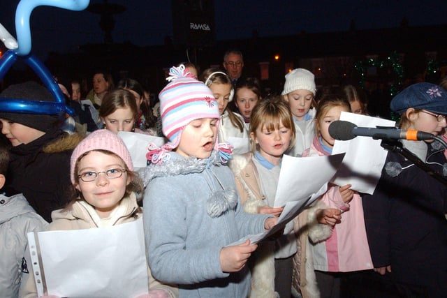 Children from the school joined in with the Christmas lights ceremony in 2004. Were you there?