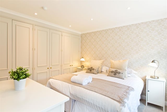 There are three bedrooms on the ground floor - one with an en-suite installed - and a further five on the first floor, of which four have en-suites. The first floor has a large floor-to-ceiling 'glass corridor' - a landing with substantial windows.