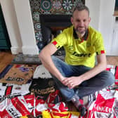 Sheffield United fan David Beeden with just a small part of his huge collection of Blades shirts dating back to the 1970s