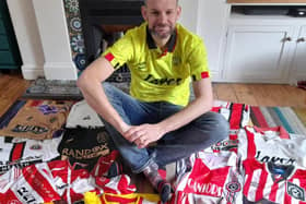 Sheffield United fan David Beeden with just a small part of his huge collection of Blades shirts dating back to the 1970s