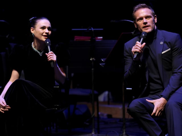 Sophie Skelton (Brianna) and Sam Heughan (Jamie Fraser) on stage during the panel discussion at the Outlander Season 6 premiere.