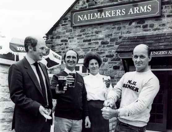 Pictured at the reopening ceremony of the Nailmakers Arms pub at Norton are champion nail bender Ben Read (right) demonstrating the art to William Younger's Inns Director John Campbell (left) and licensees Duggie and Pat Williams, August 9, 1984