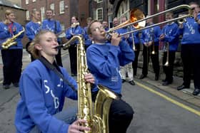 Members of the Sheffield Youth Big Band entertain at St Peter's Close in Sheffield city centre on September 7, 2001. The event was part of the Axis Architecture street party and in the foreground are Hannah Lawder and Julian Hepple