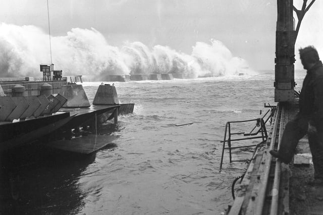 Severe storms lashed the North East coast in 1975 and this picture at the Sunderland South Docks shipyard of Austin and Pickersgill shows waves crashing against the south breakwater, sometimes reaching 100 feet high.  Work on the after-end of ships on the berths had to be suspended.