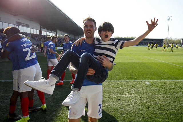 Tom Naylor carries a young fan while celebrating