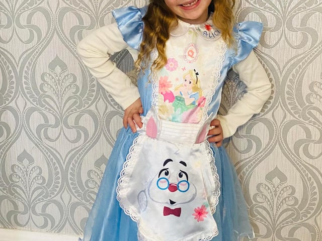 Bella Neville Age 6 from Baffins dressed as Alice in Wonderland for World Book Day.