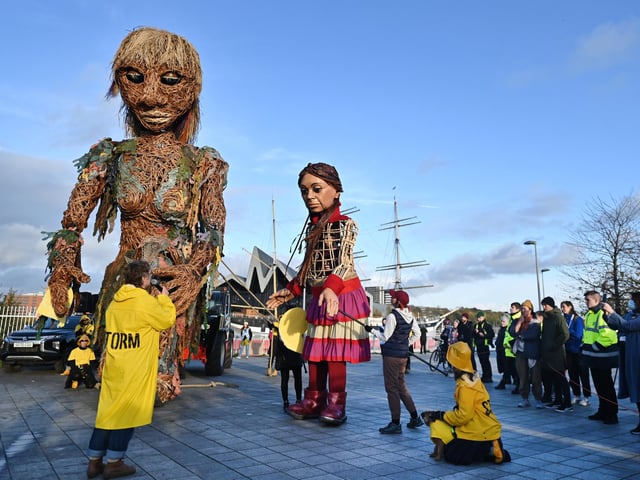 Storm, who is a ten-metre tall "goddess of the sea" and made entirely of recycled materials, met Little Amal - a three-and-a-half metre tall Syrian refugee puppet. The two puppets met near the old Govan Graving Docks at 1.30pm and walked through Govan, greeting children from local Govan primary schools.
