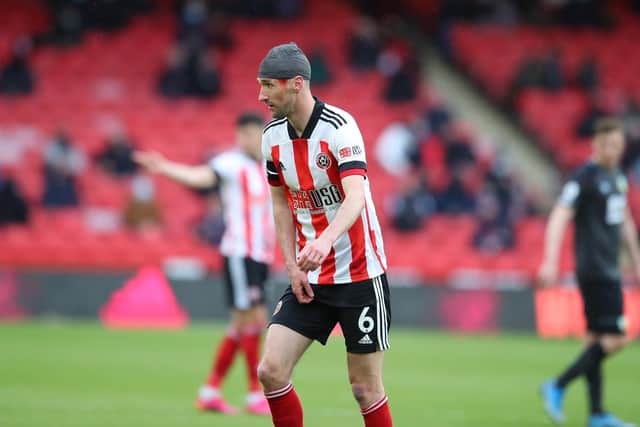 Chris Basham sported a headband against Burnley after taking a knock to the head: Simon Bellis / Sportimage