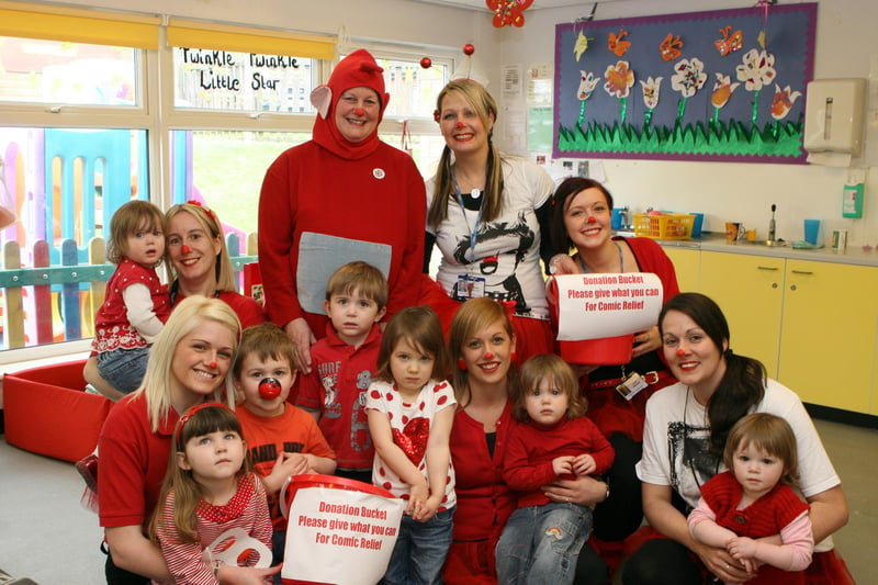 Children and staff at Sunshine Nursery in Chesterfield dress in the colour of Red Nose Day in 2011.